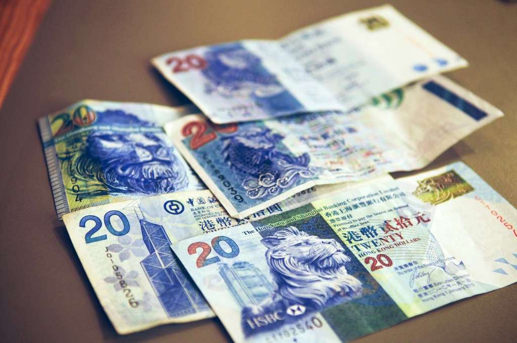 20 and 50 banknotes on brown wooden table